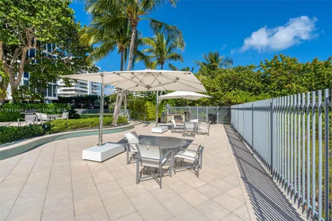 a view of building with yard and swimming pool
