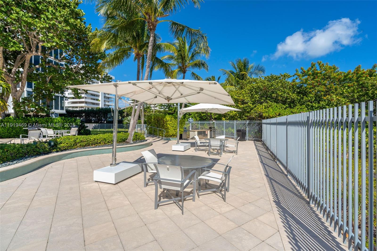 200 Ocean Ln Drive, Unit 407GR09 Key Biscayne, FL 33149 - Photo 38 of 56 a view of backyard with swimming pool and patio