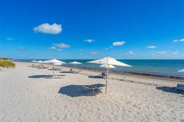 a view of a backyard with a lake view