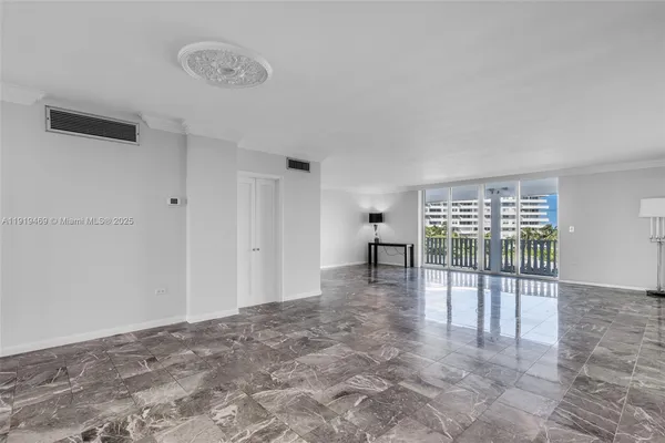 a view of empty room with floor to ceiling window