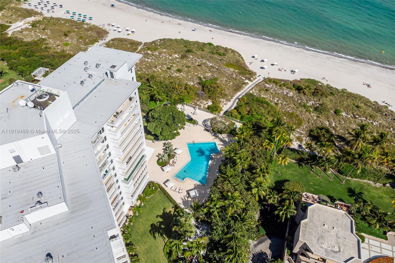 200 Ocean Ln Drive, Unit 407GR09 Key Biscayne, FL 33149 - Photo 50 of 56 an aerial view of a house with a yard and lake view
