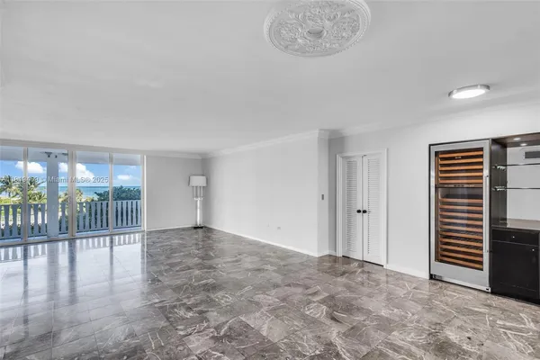 a view of an empty room and glass door
