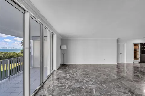 a view of an empty room and a window