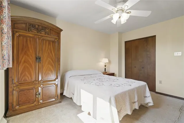 a bedroom with a bed and cabinets