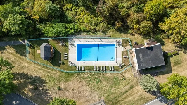 a house with trees in the background