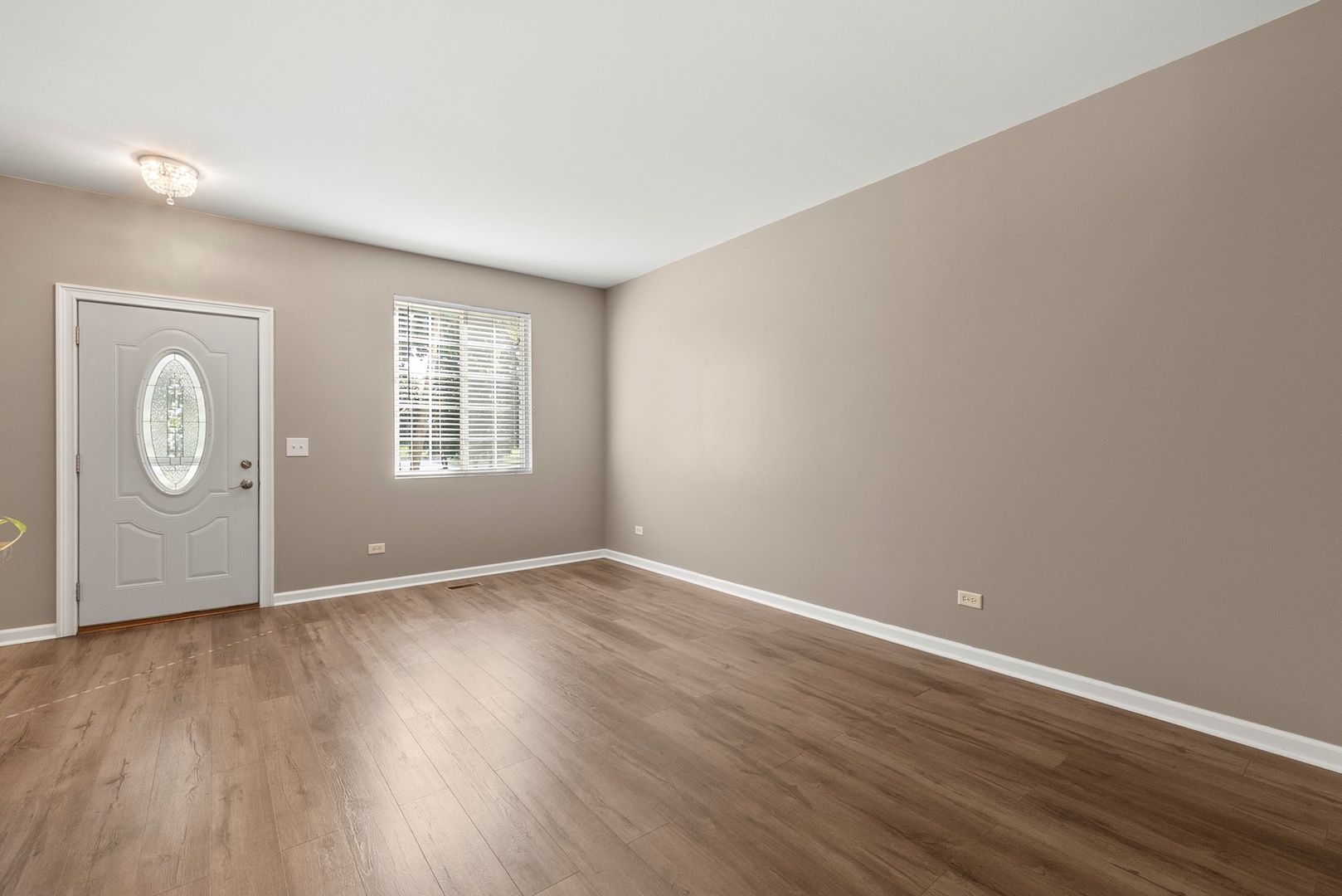 1565 Azalea Circle Romeoville, IL 60446 - Photo 11 of 30 an empty room with wooden floor and windows