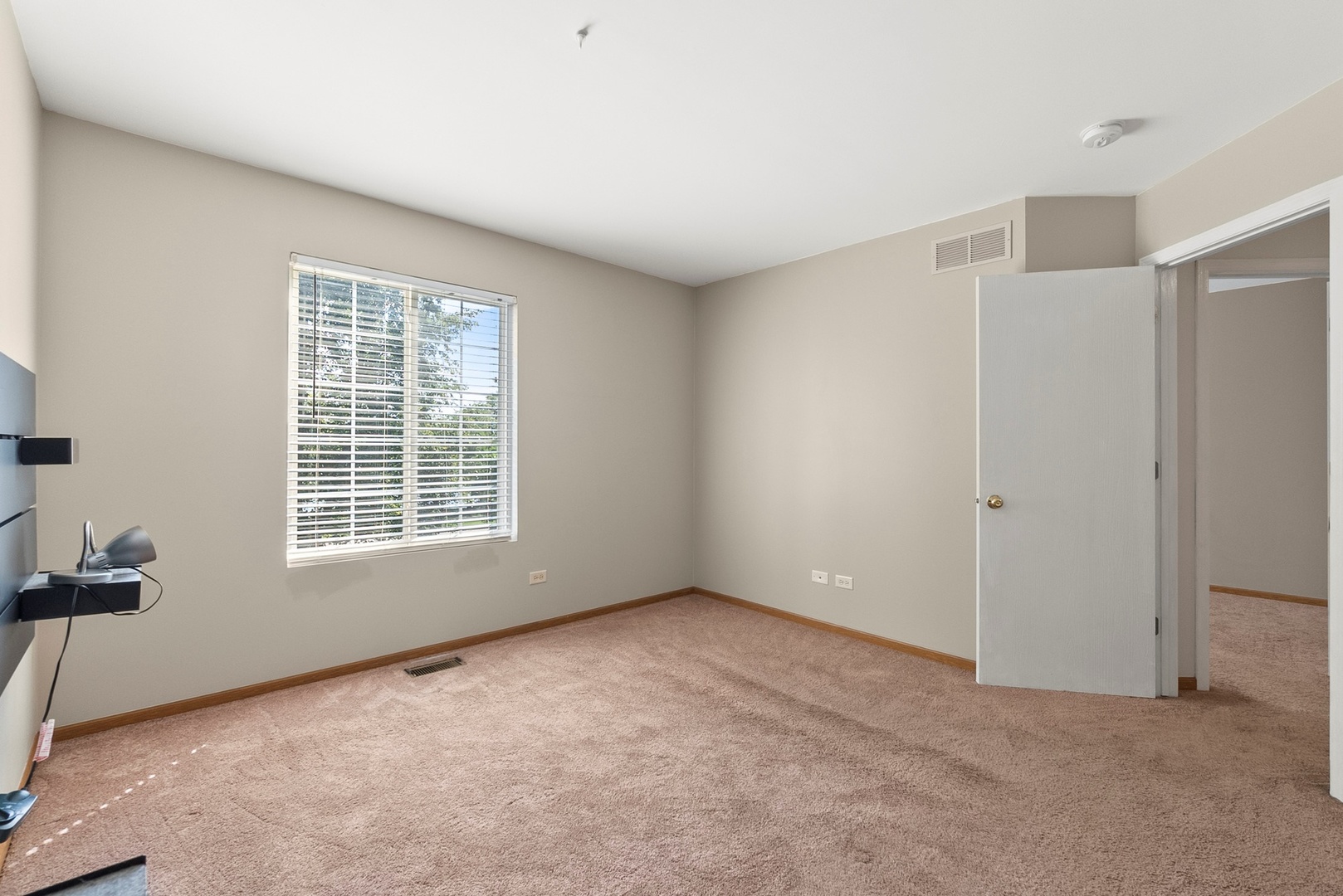 1565 Azalea Circle Romeoville, IL 60446 - Photo 17 of 30 a view of an empty room with a window