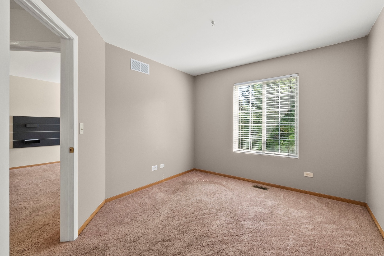 1565 Azalea Circle Romeoville, IL 60446 - Photo 19 of 30 a view of an empty room with a window