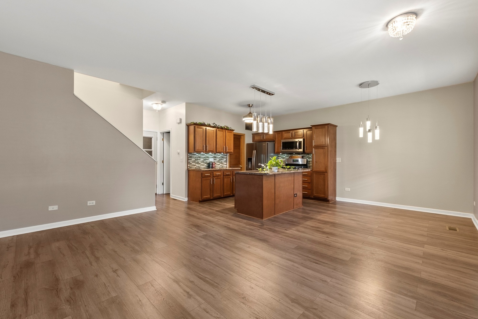 1565 Azalea Circle Romeoville, IL 60446 - Photo 2 of 30 a view of kitchen and kitchen with furniture wooden floor and window