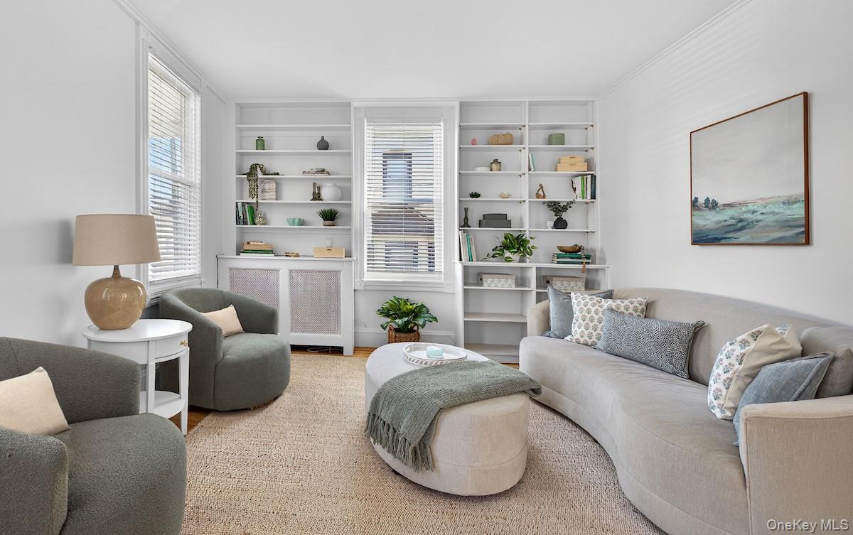 64 Maple Street Dobbs Ferry, NY 10522 - Photo 4 of 36 Living room with floor-to-ceiling shelves