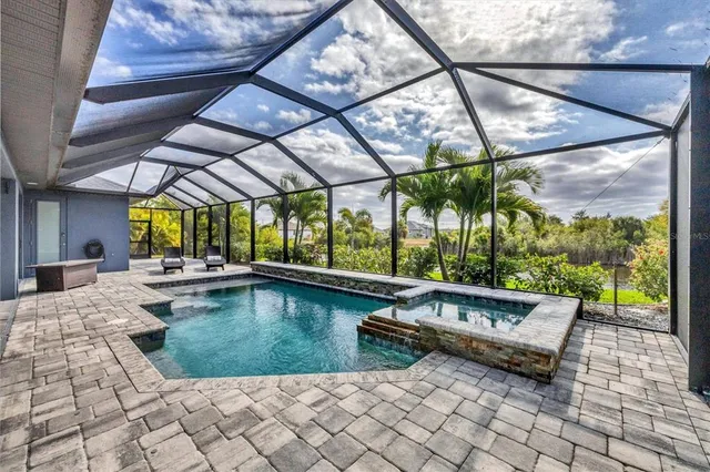 a view of swimming pool with a sitting area