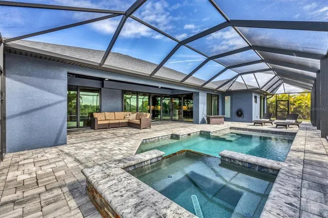 a view of a swimming pool with a patio