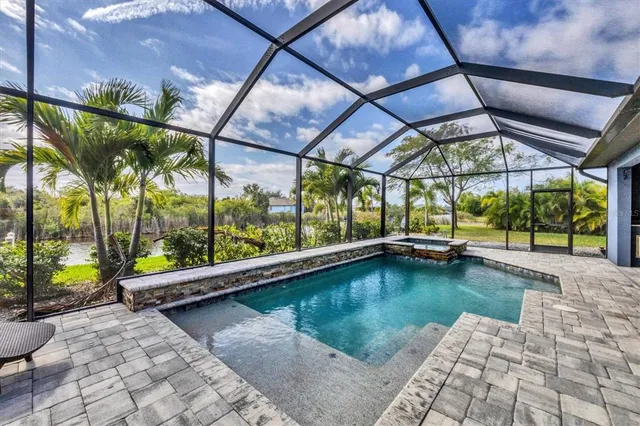 a view of swimming pool with a patio
