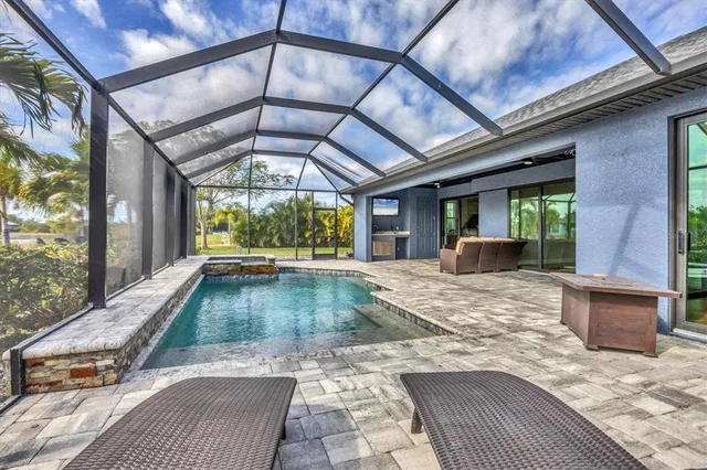 a view of a patio with a table and chairs