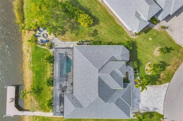 aerial view of a house with a yard