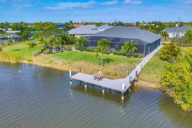 swimming pool with outdoor seating and yard