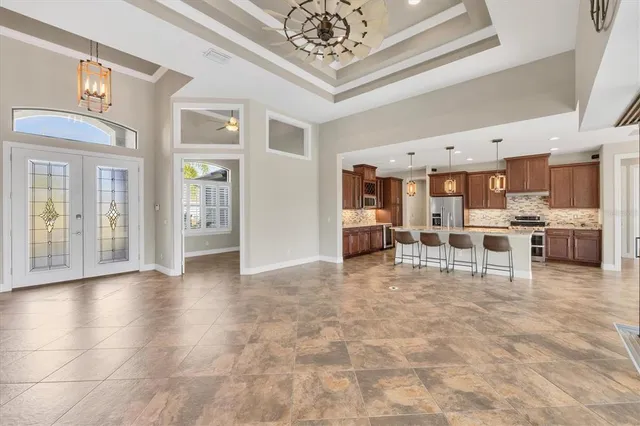 a view of a livingroom with furniture and a chandelier