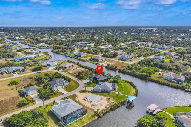 an aerial view of residential houses with outdoor space