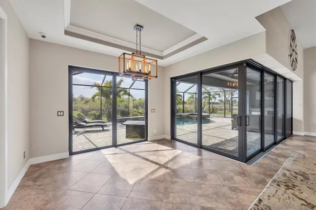 a view of a livingroom with a ceiling fan and windows