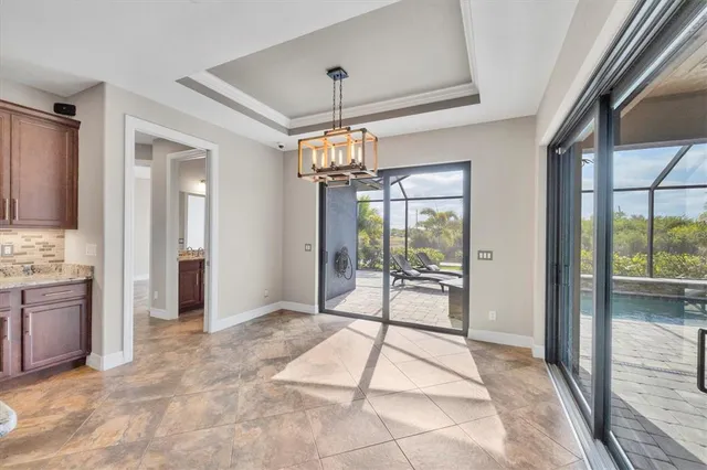 a view of an entryway with wooden floor and a livingroom