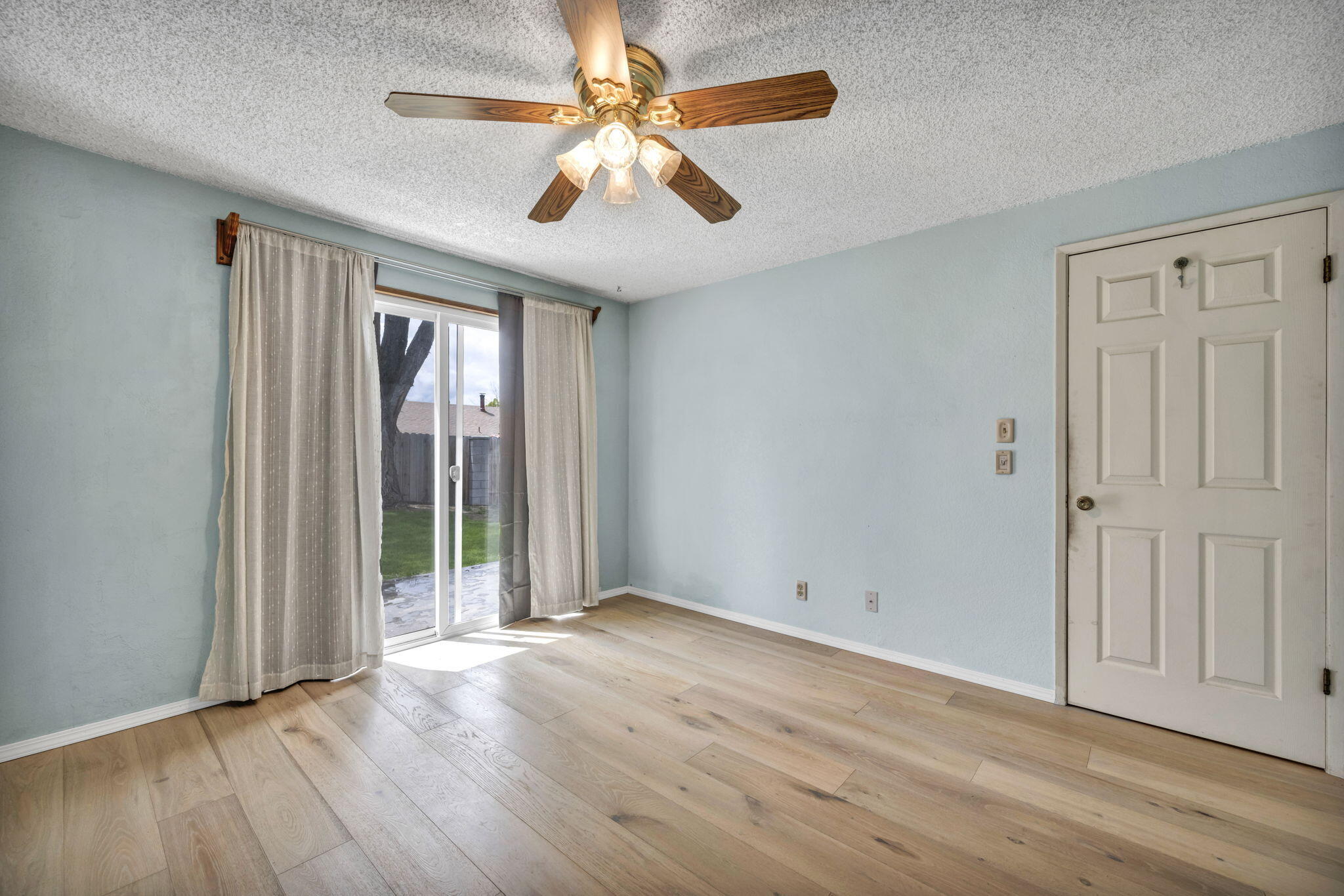 3760 Brant Street Reno, NV 89508 - Photo 16 of 42 an empty room with wooden floor fan and windows