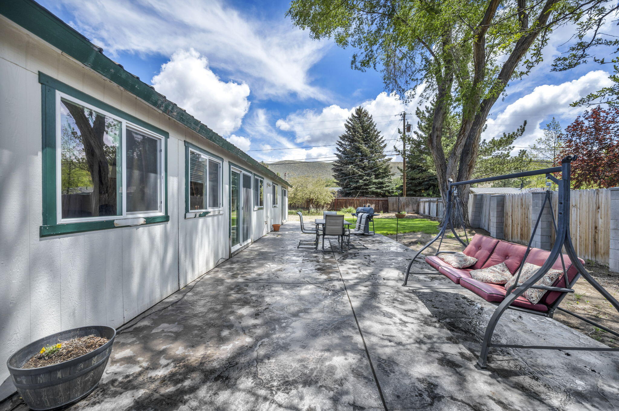 3760 Brant Street Reno, NV 89508 - Photo 30 of 42 a view of a patio with table and chairs and wooden fence