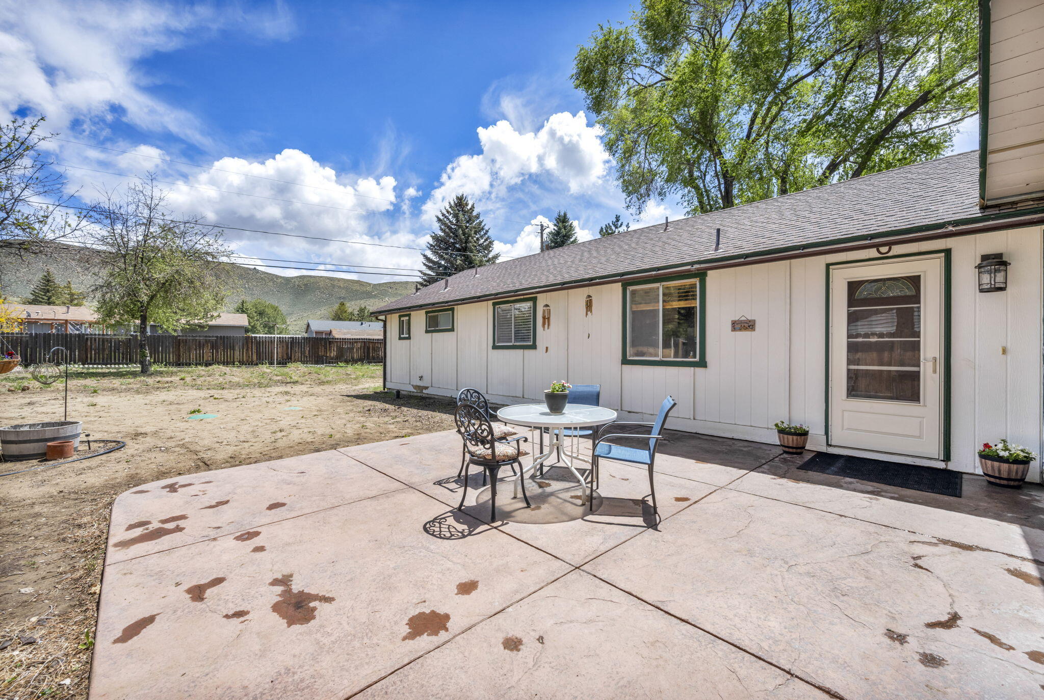 3760 Brant Street Reno, NV 89508 - Photo 3 of 42 a backyard of a house with table and chairs