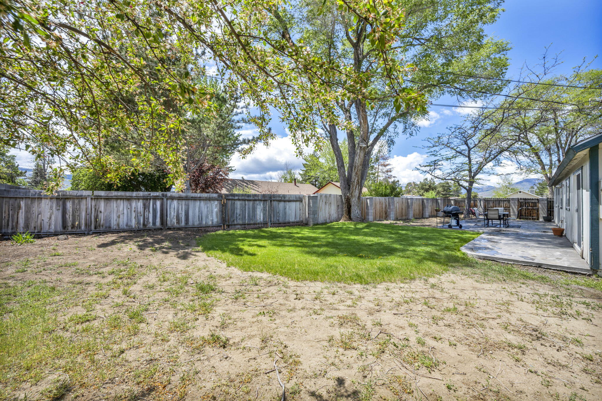3760 Brant Street Reno, NV 89508 - Photo 33 of 42 a backyard with tall trees