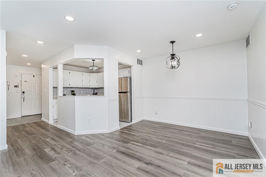 612 Chester Court Helmetta, NJ 08828 - Photo 13 of 31 a view of a kitchen with a refrigerator and wooden floor