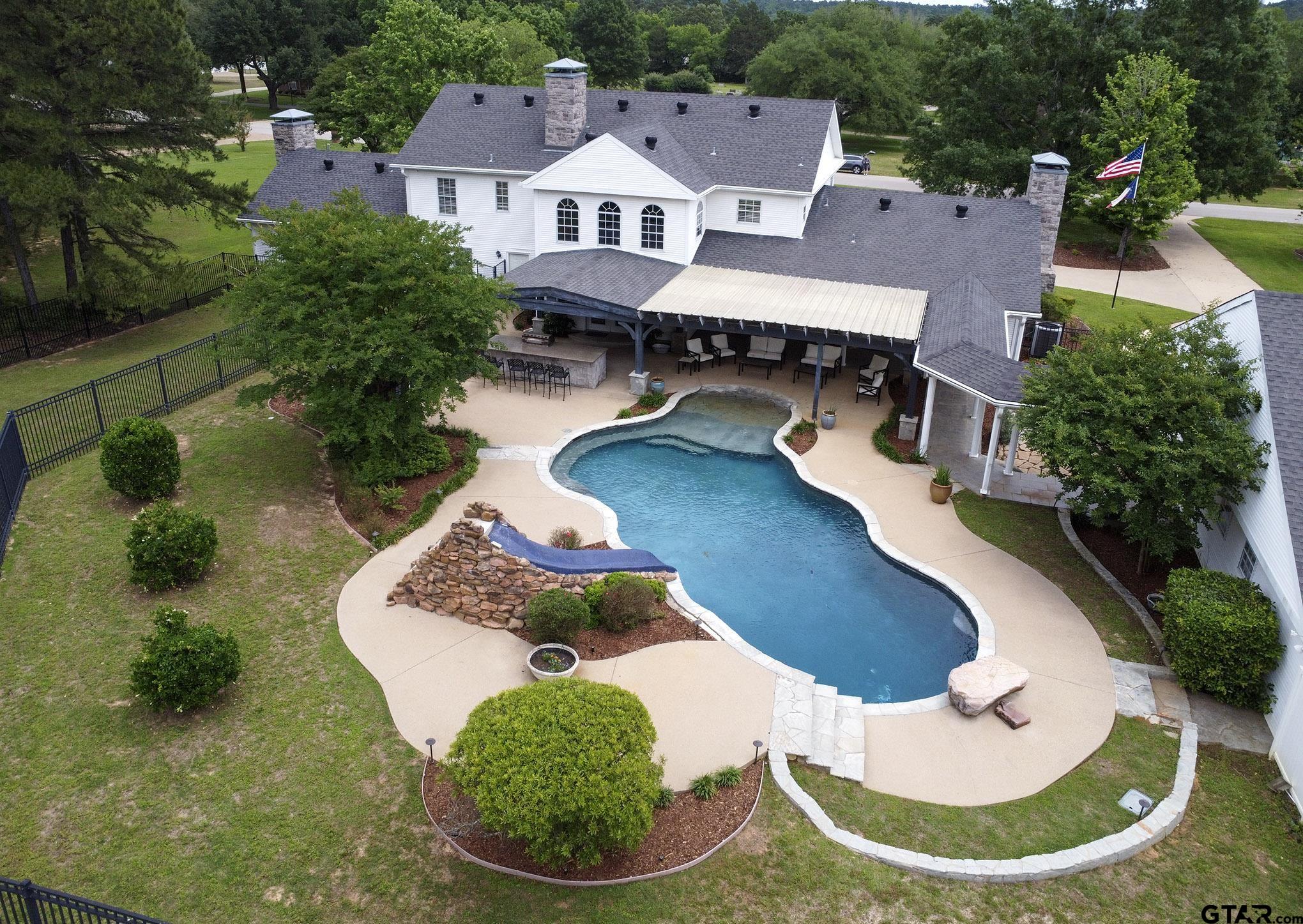 18722 Ridgeline Road Tyler, TX 75703 - Photo 3 of 47 a view of a swimming pool with sitting area