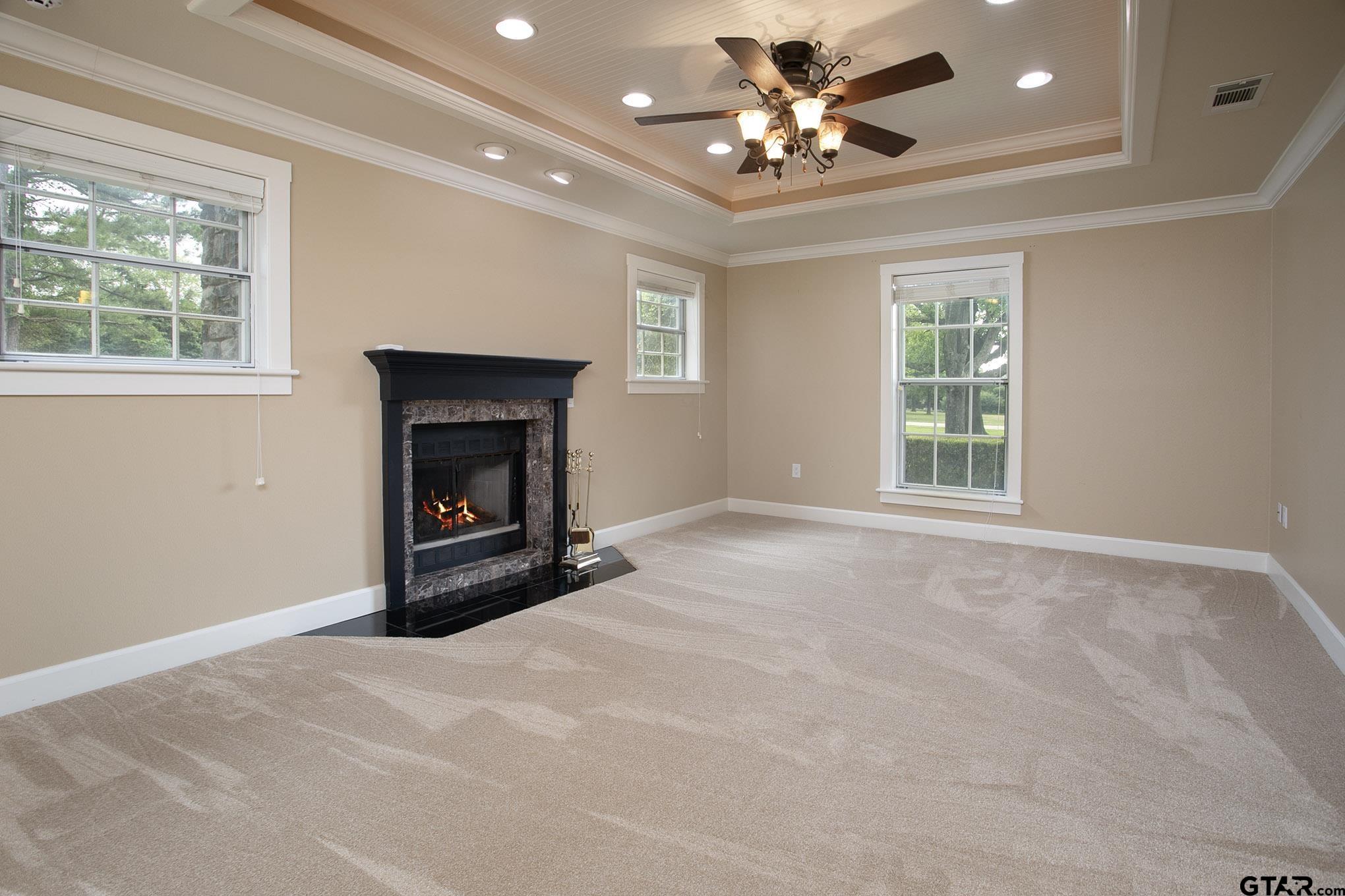 18722 Ridgeline Road Tyler, TX 75703 - Photo 36 of 47 a view of livingroom with window fireplace