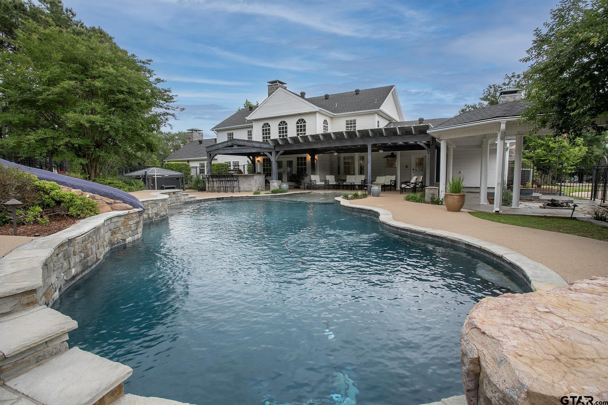 18722 Ridgeline Road Tyler, TX 75703 - Photo 4 of 47 a front view of a house with swimming pool