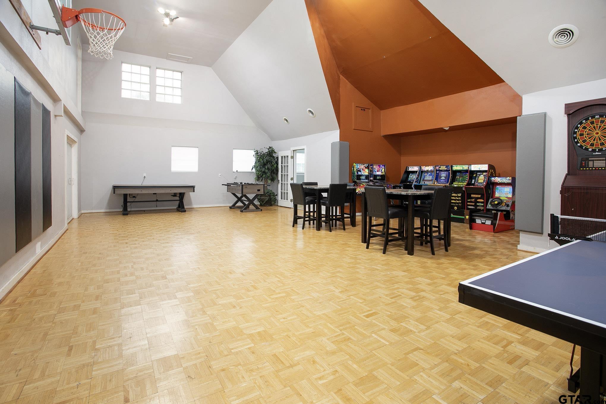 18722 Ridgeline Road Tyler, TX 75703 - Photo 44 of 47 Huge game room located behind the detached garage. High ceilings and basketball goal.