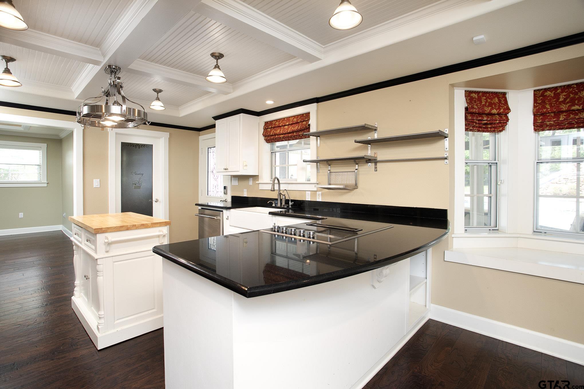 18722 Ridgeline Road Tyler, TX 75703 - Photo 5 of 47 a kitchen with stainless steel appliances granite countertop a sink a stove and a refrigerator