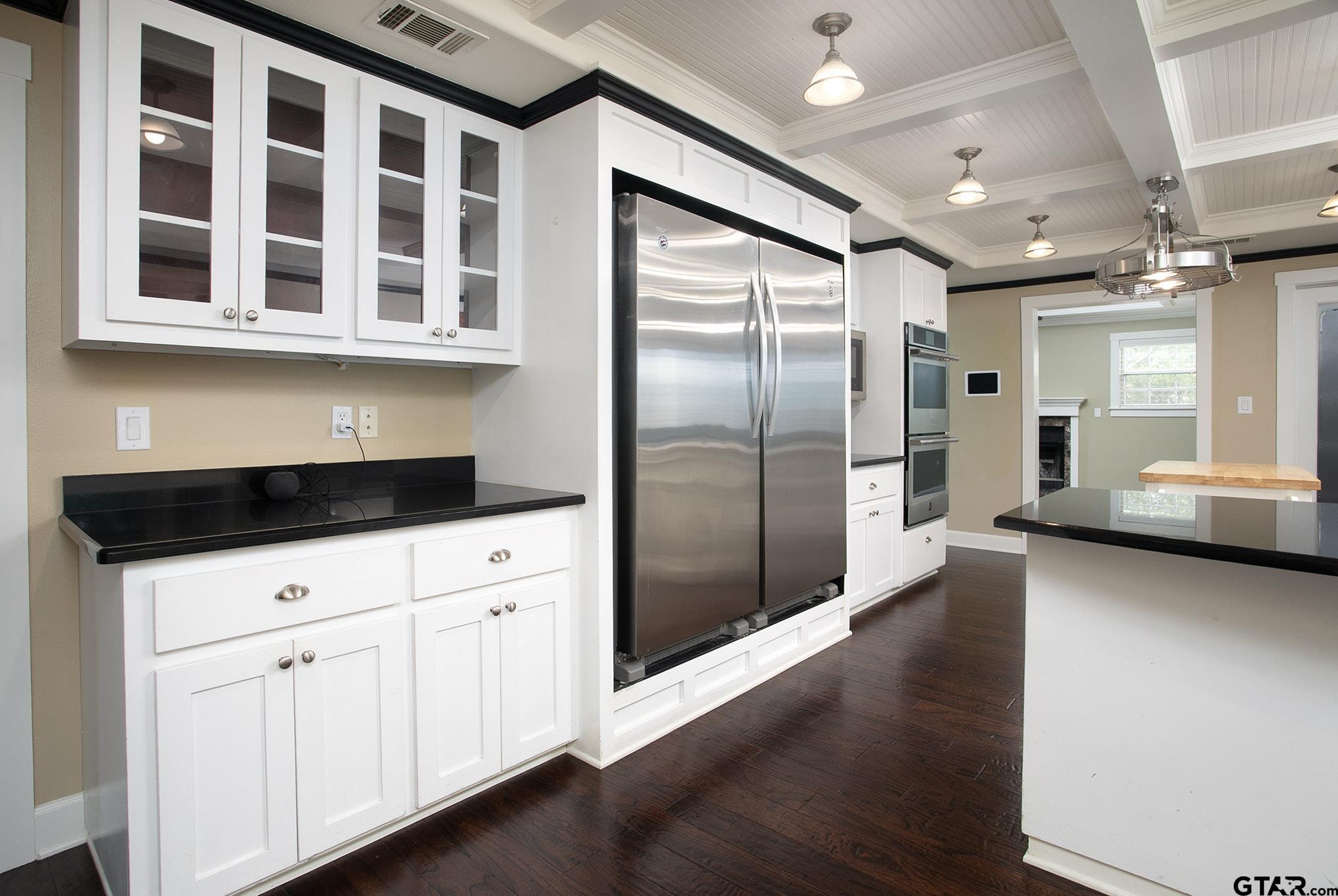 18722 Ridgeline Road Tyler, TX 75703 - Photo 7 of 47 a kitchen with stainless steel appliances a refrigerator and a sink