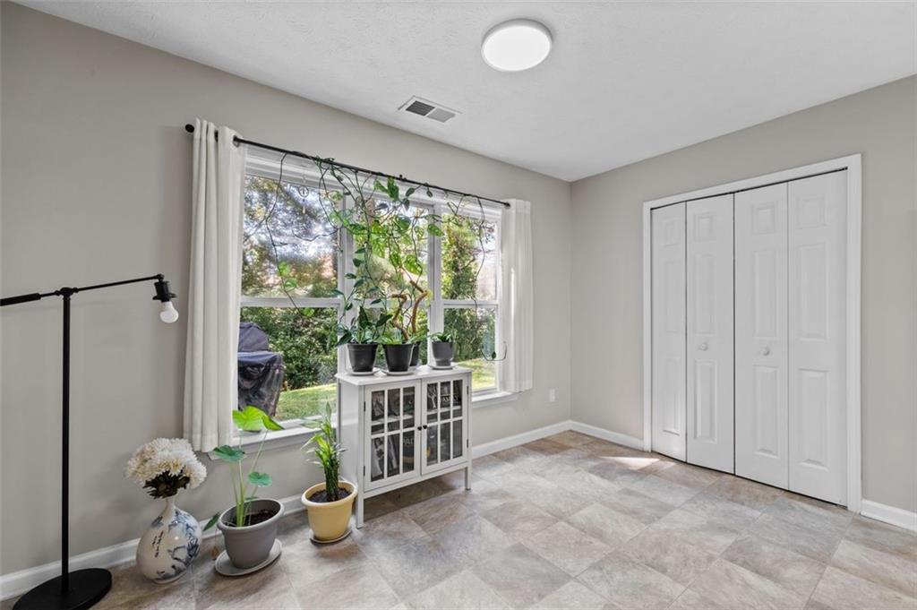 6115 Riveroak Terrace Atlanta, GA 30349 - Photo 16 of 41 a view of a room with toys and a large window