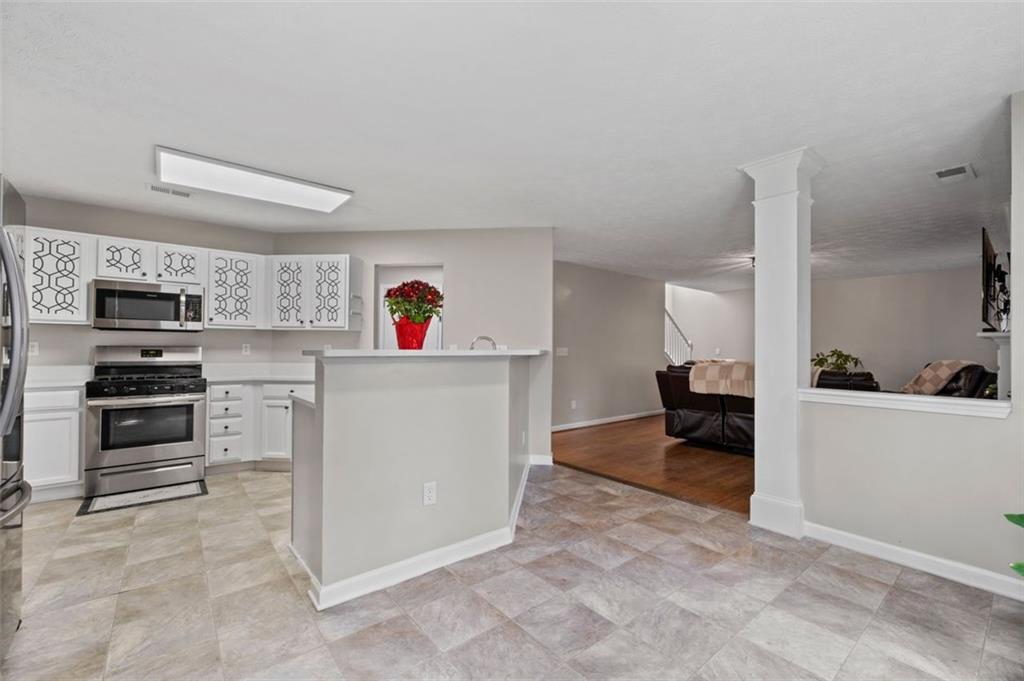 6115 Riveroak Terrace Atlanta, GA 30349 - Photo 17 of 41 a view of a kitchen with fridge and sink