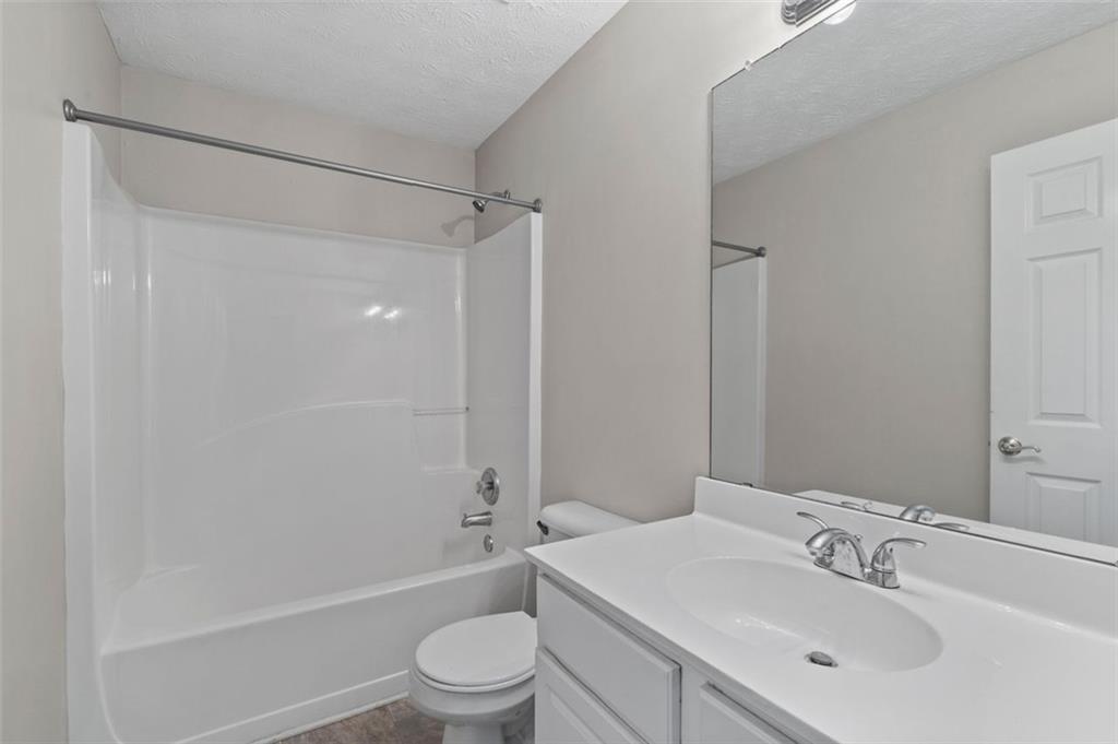 6115 Riveroak Terrace Atlanta, GA 30349 - Photo 24 of 41 a bathroom with a sink toilet and shower