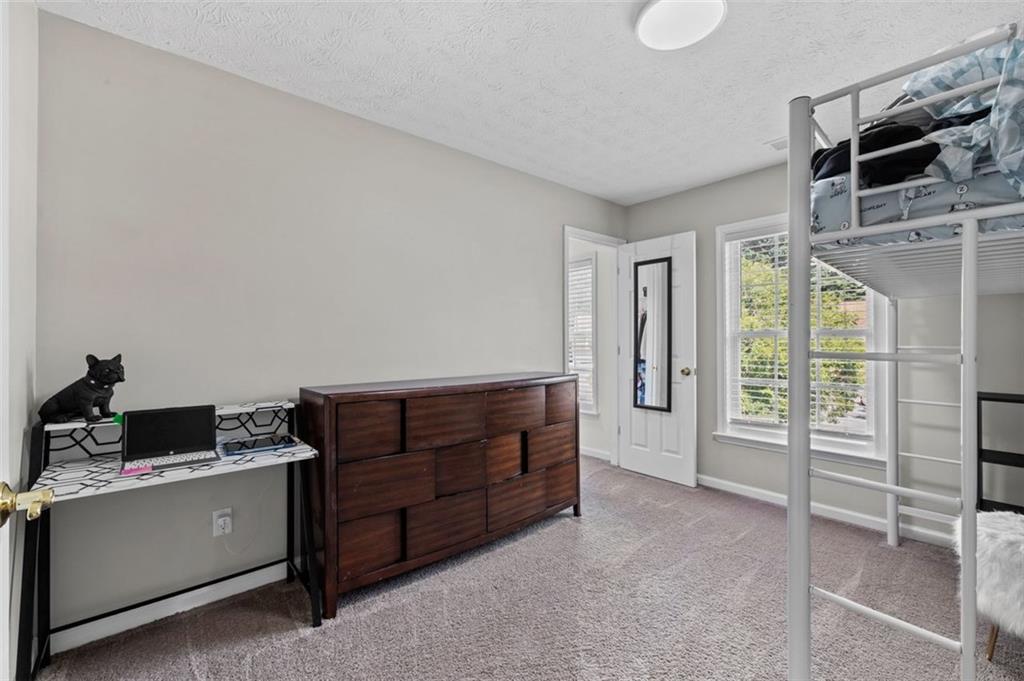 6115 Riveroak Terrace Atlanta, GA 30349 - Photo 25 of 41 a room with furniture and window