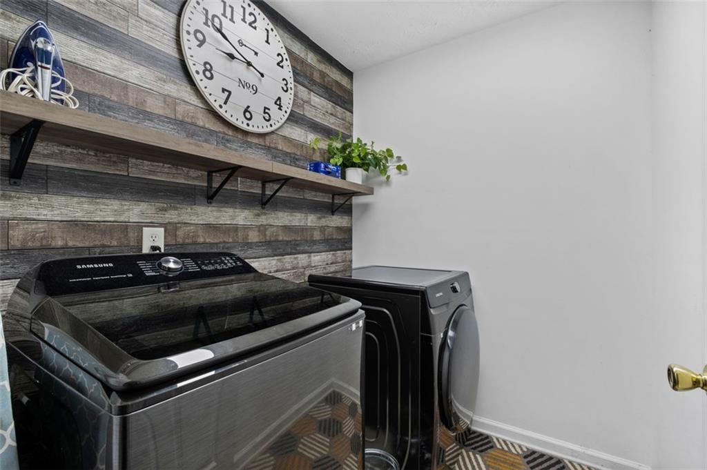 6115 Riveroak Terrace Atlanta, GA 30349 - Photo 28 of 41 a stove top oven sitting inside of a kitchen