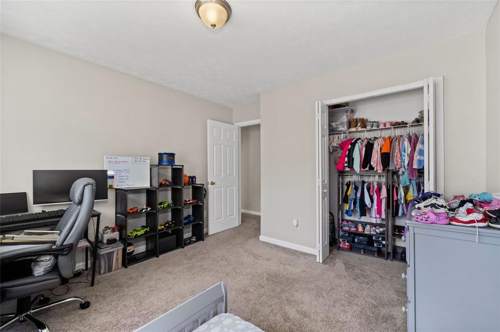 6115 Riveroak Terrace Atlanta, GA 30349 - Photo 30 of 41 a view of a room with gym equipment