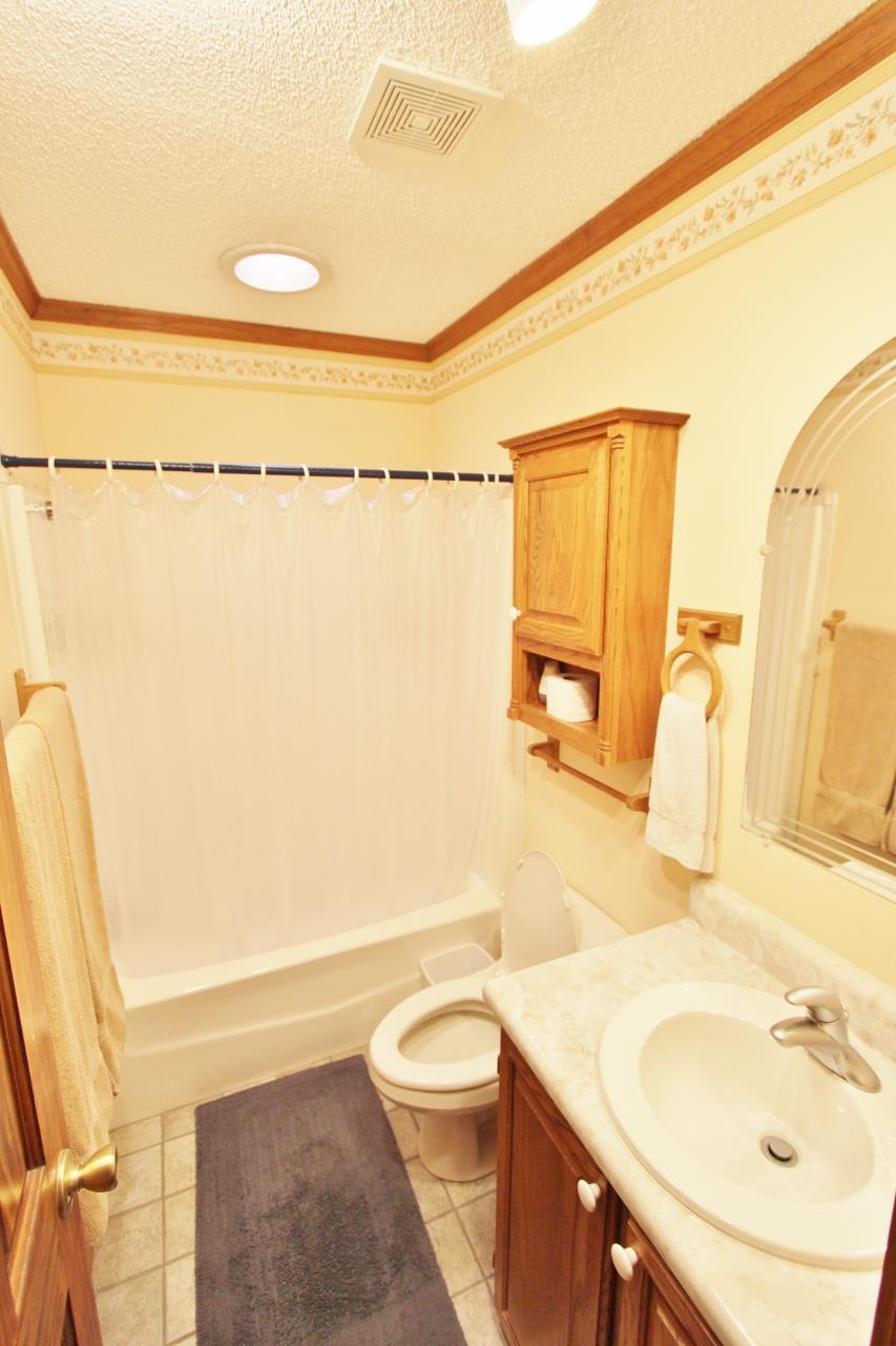 6830 Beasleys Bend Road Lebanon, TN 37087 - Photo 11 of 30 a bathroom with a sink a toilet and shower