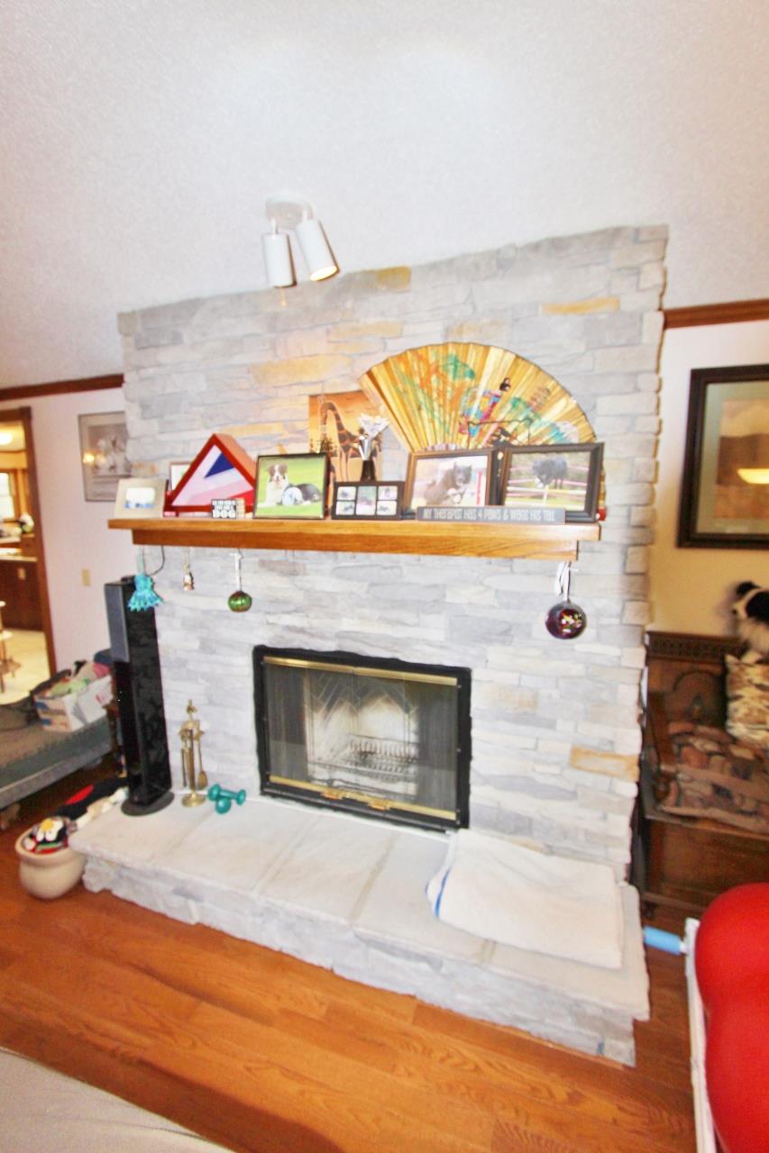6830 Beasleys Bend Road Lebanon, TN 37087 - Photo 18 of 30 a living room with furniture and a fireplace