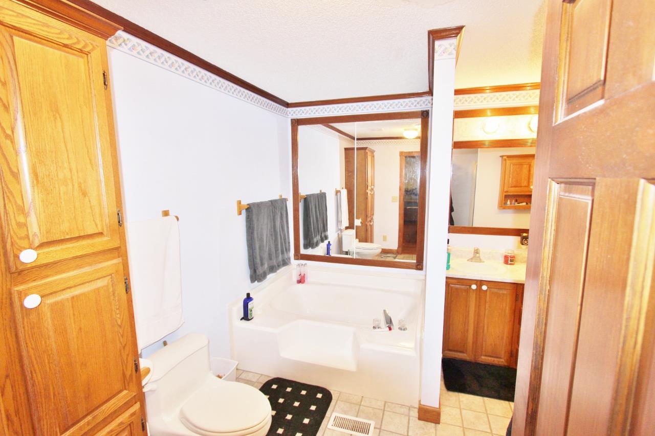 6830 Beasleys Bend Road Lebanon, TN 37087 - Photo 20 of 30 a bathroom with a sink toilet and shower