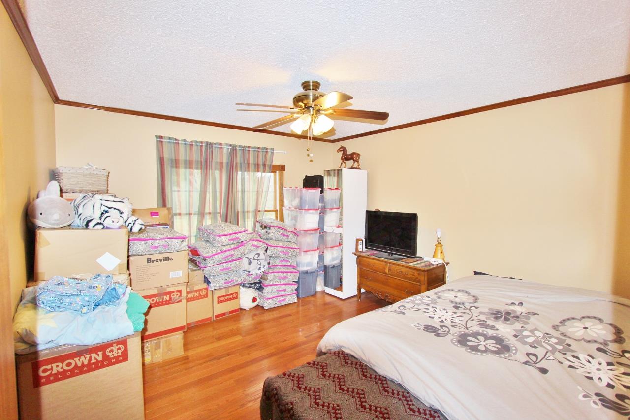 6830 Beasleys Bend Road Lebanon, TN 37087 - Photo 10 of 30 a bedroom with a bed and wooden floor