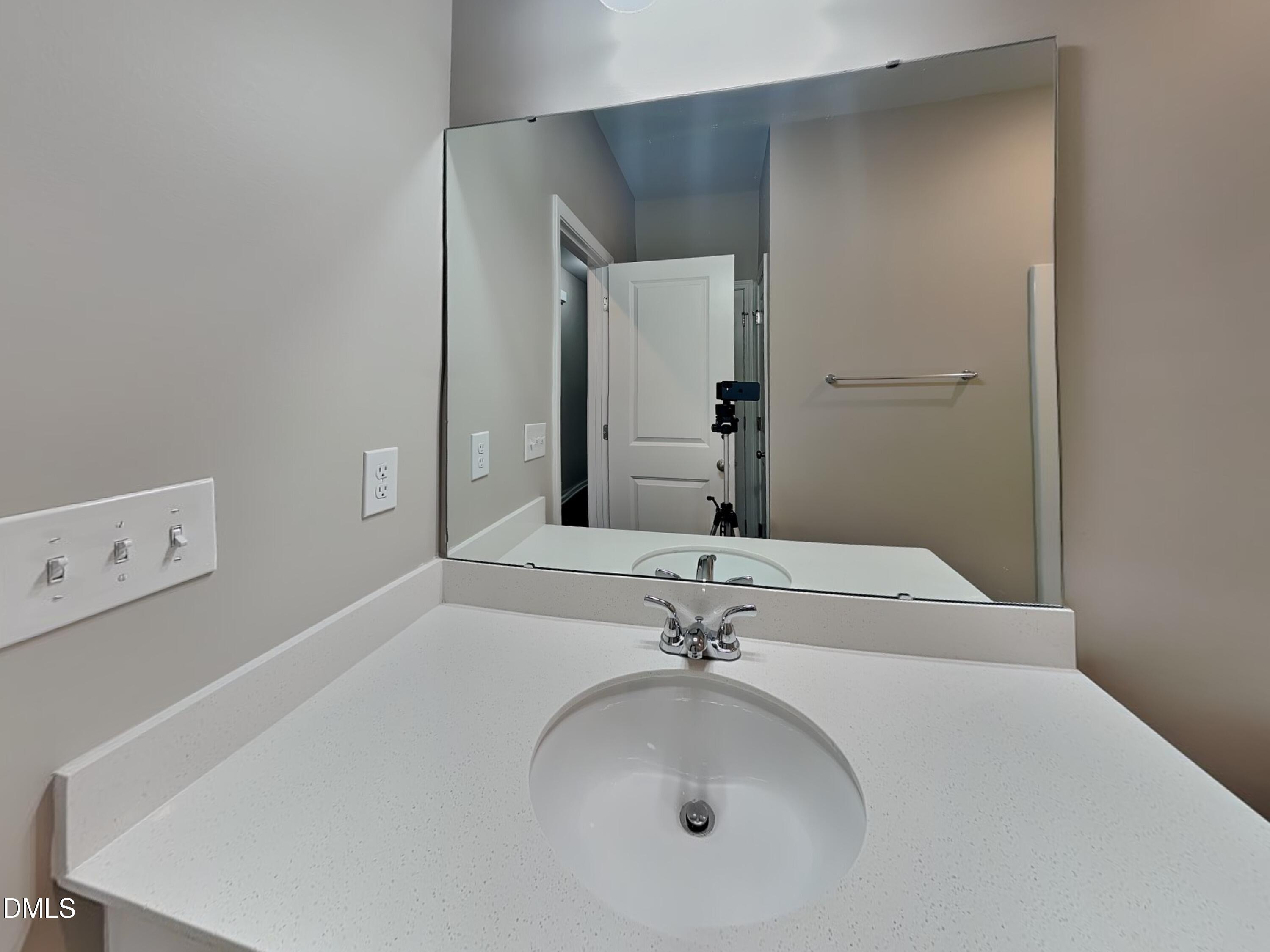 265 Frst Mdw Lane Franklinton, NC 27525 - Photo 11 of 17 a bathroom with a sink and a mirror
