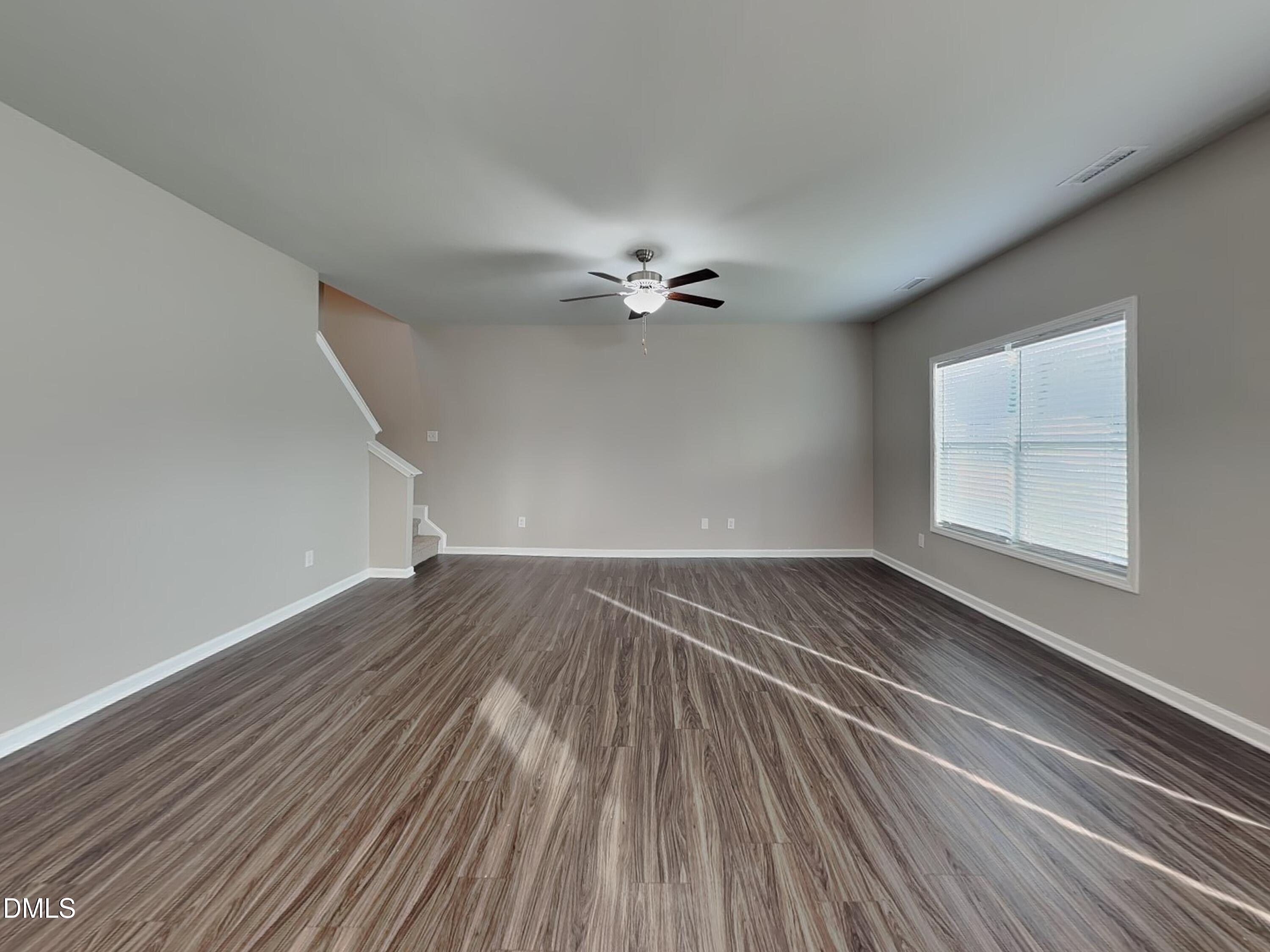 265 Frst Mdw Lane Franklinton, NC 27525 - Photo 2 of 17 wooden floor in an empty room with a window