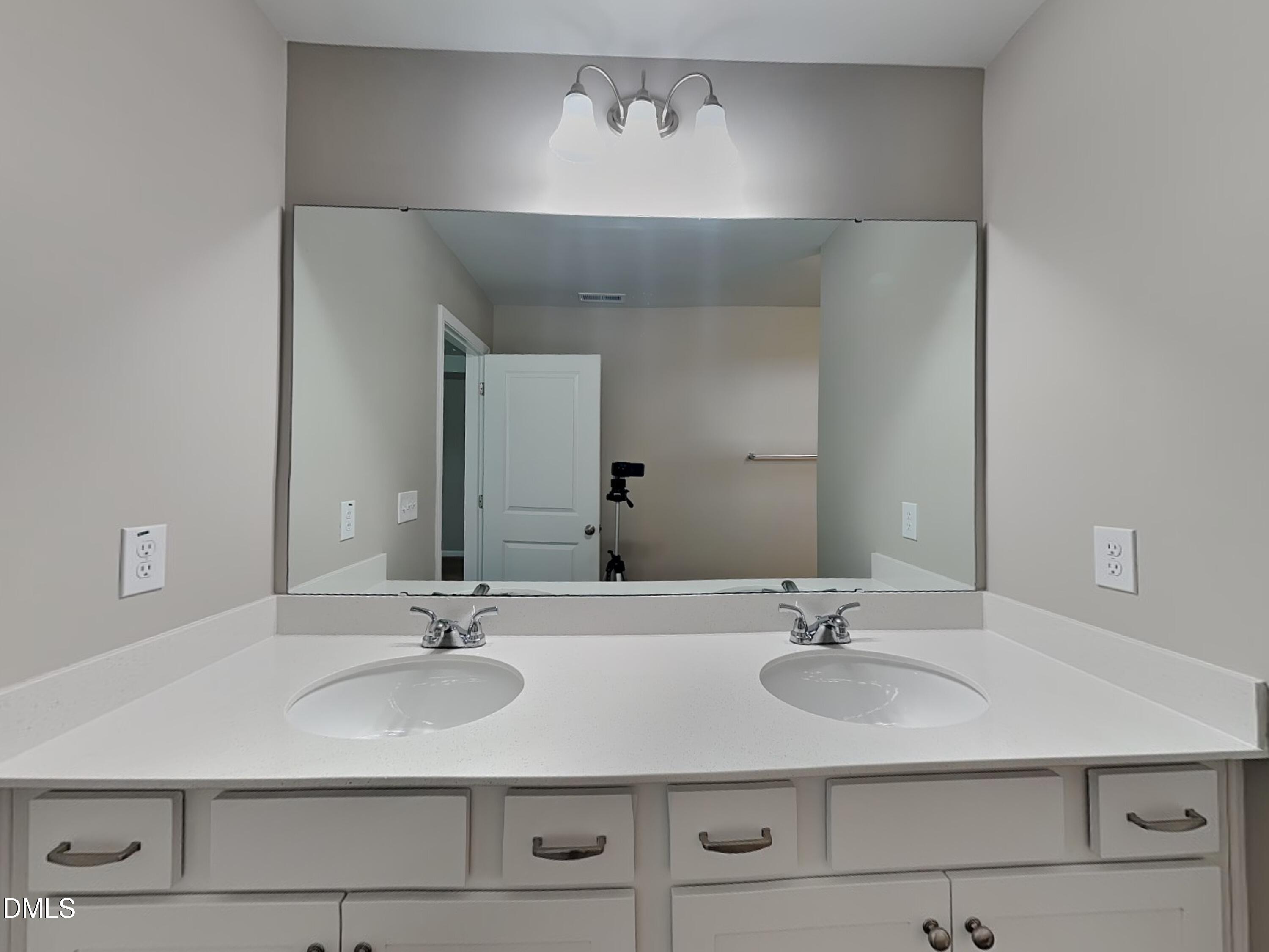 265 Frst Mdw Lane Franklinton, NC 27525 - Photo 6 of 17 a bathroom with a sink and a mirror