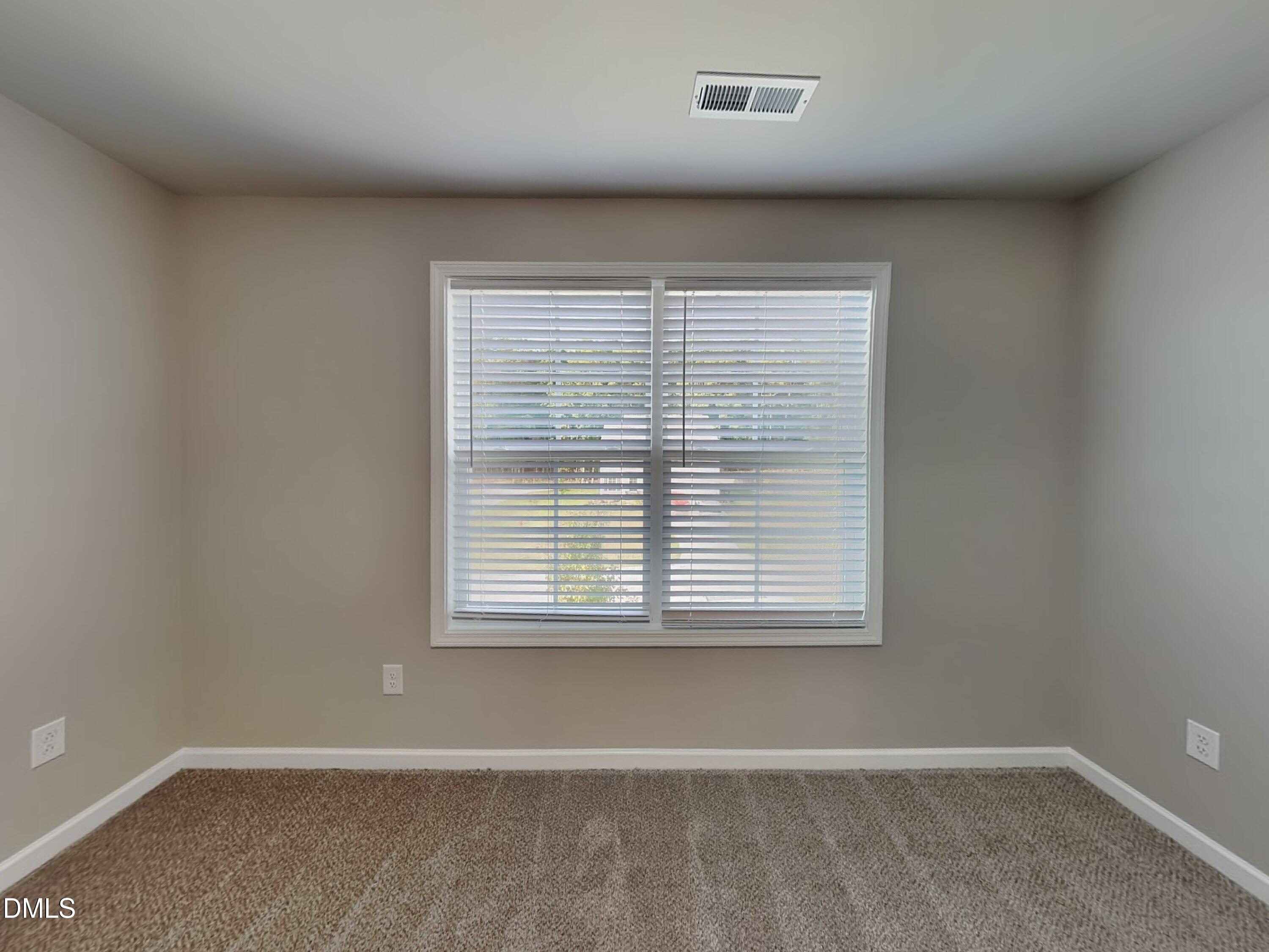 265 Frst Mdw Lane Franklinton, NC 27525 - Photo 8 of 17 an empty room with a window