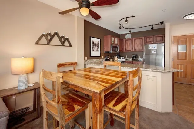 a dining room with furniture and window